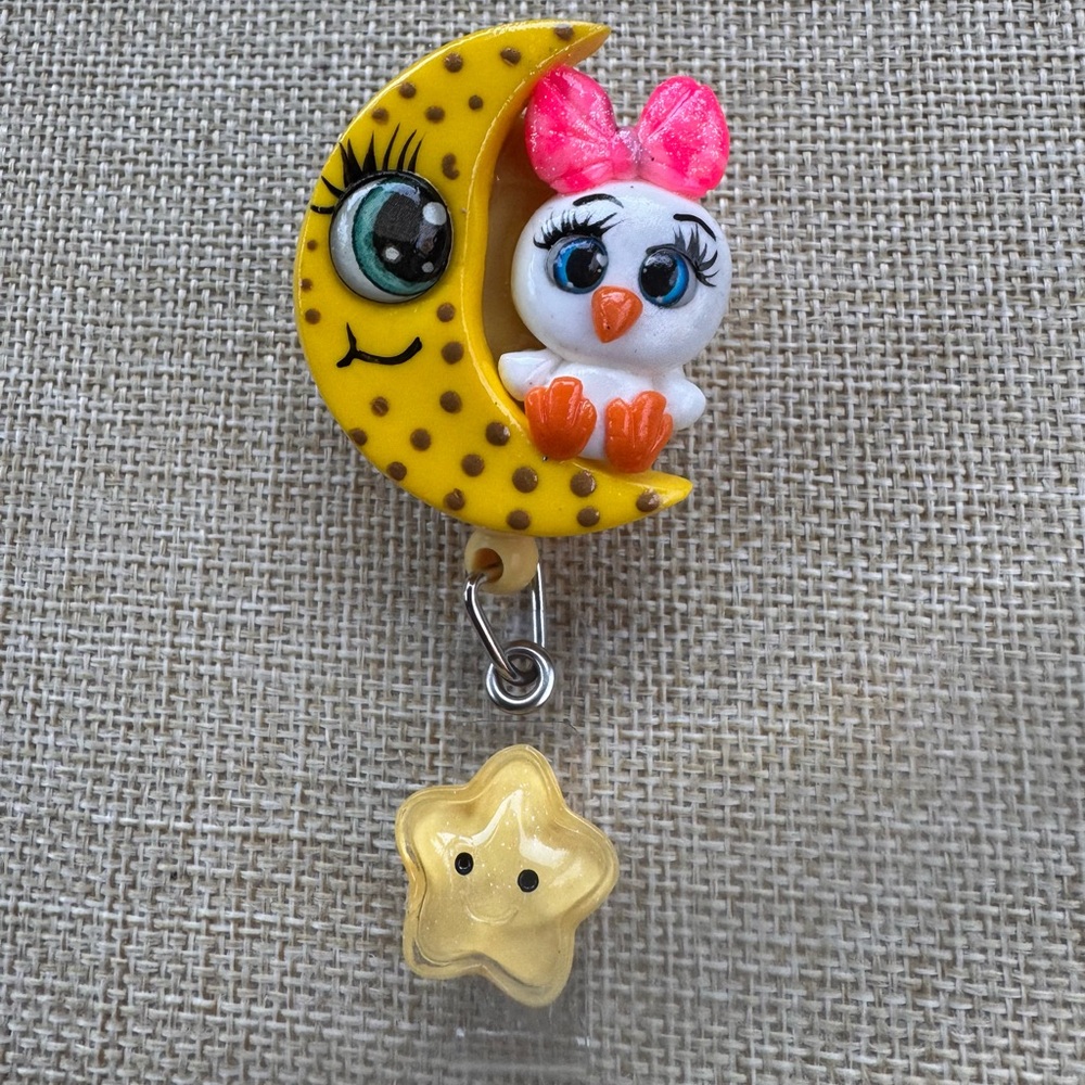 Yellow Moon and Pink Bow duck badge reel
